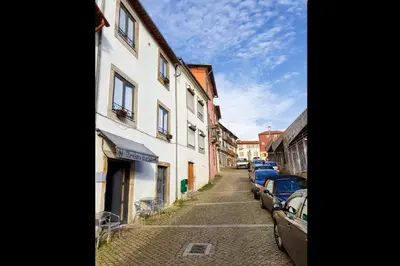 a street with cars parked on the side of a building at Great Flat & View in Historic Porto by LovelyStay in Porto