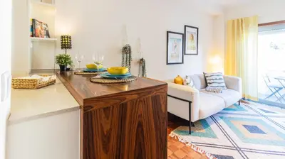 a living room with a table and a couch at Adorable apartment 2D in Porto