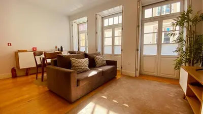 a living room with a couch and a table at SM Apartments in Porto