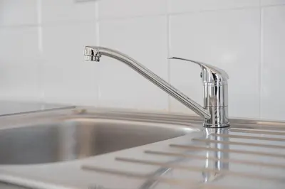 a kitchen sink with a chrome kitchen faucet at GuestReady - Oporto Old Town House 3 in Porto
