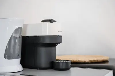 a coffee maker on a counter with a piece of bread at GuestReady - Oporto Old Town House 3 in Porto