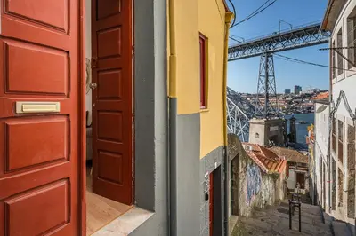 a door to a building with a view of a bridge at GuestReady - Oporto Old Town House 2 in Porto