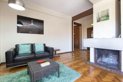 a living room with a couch and a fireplace at LV Premier Apartments Clerigos-RE2 in Porto