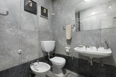 a bathroom with a toilet and a sink at LV Premier Apartments Clerigos-RE2 in Porto