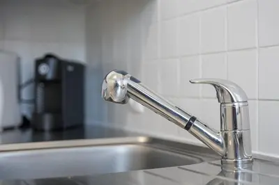 a table on a balcony with a view of a city at GuestReady - Old City Design Apartments in Porto