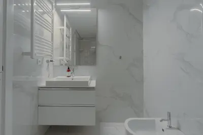 a white bedroom with a white bed and a white wall at Brand New Musas Ap by Best2Stay in Porto