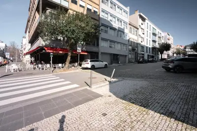 a city street with a white car parked on the street at Brand New Musas Ap by Best2Stay in Porto