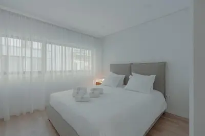 a hallway with a sliding door leading to a dining room at Brand New Musas Ap by Best2Stay in Porto
