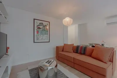 a white bathroom with a toilet and a sink at Brand New Musas Ap by Best2Stay in Porto