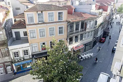 a city street with buildings and a christmas tree at Coliseu Downtown Loft in Porto