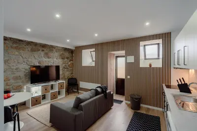 a living room with a couch and a tv at Yellow House by Best2Stay in Vila Nova de Gaia