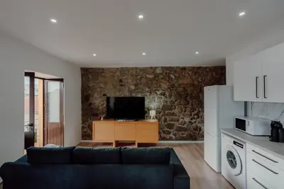 a bedroom with a desk and a chair and a mirror at House River View by Best2Stay in Vila Nova de Gaia