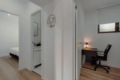 a small building with a red door and stairs at House River View by Best2Stay in Vila Nova de Gaia