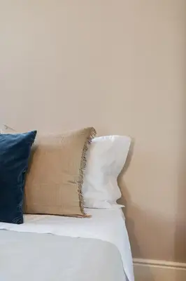 a pile of pillows sitting on top of a bed at Downtown Refuge Camões in Porto
