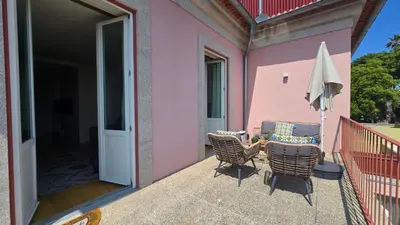 a yellow couch in a living room with a table at Pink Lux Apartments in Porto