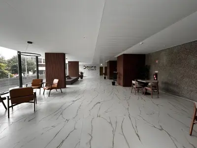 a lobby with a marble floor and tables and chairs at New Douro 908 with parking in Vila Nova de Gaia