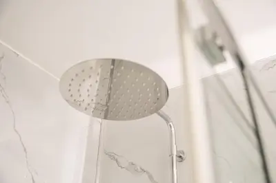 a shower head in the corner of a shower at GuestReady - One perfect home near the city centre in Porto
