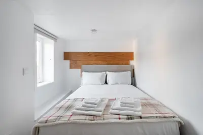 a bedroom with a bed with two towels on it at GuestReady - Oporto Old Town House 1 in Porto