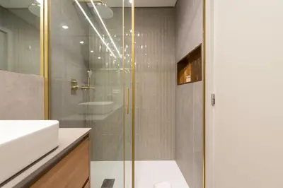 a bathroom with a shower and a sink at DoisPontoZero Campo 24 Agosto in Porto