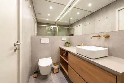 a bathroom with a sink and a toilet at DoisPontoZero Campo 24 Agosto in Porto