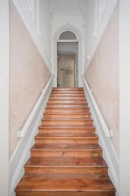 a staircase in a house with wooden floors at Liiiving in Porto - Downtown & Riverside Balcony in Porto