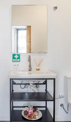 a sink in a kitchen with a plate of food at HostWise - Stylish Sunny Flats in Porto