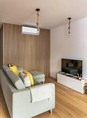 a living room with a couch and a television at Yellow Breeze Apartment by Cozy Stay in Porto