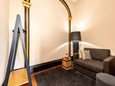 a living room with a couch and a mirror at Studio near Ribeira do Porto in Porto