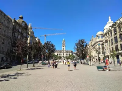 a group of people walking on a city street at 2 Bedroom Apartment in Oporto in Porto