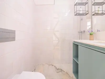 a bathroom with a sink and a toilet at Charming studio in the heart of Porto in Porto