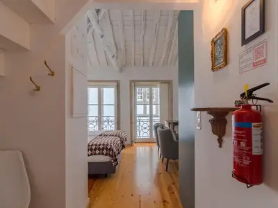 a living room with a fire hydrant in a room at Central Porto with comfort & convenience in Porto