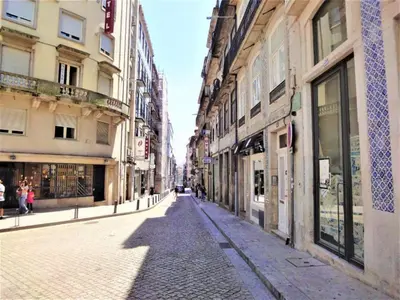 an empty street in a city with buildings at Charming apartment in Porto s Center in Porto