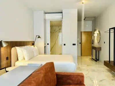 a hotel room with a bed and a couch at Convenient apartment in the heart of Porto in Porto