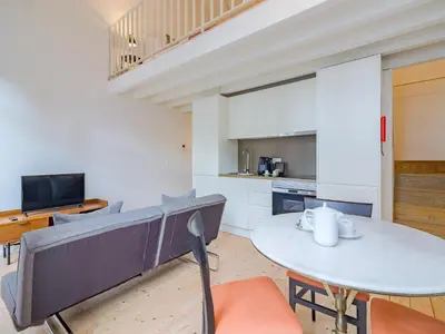 a kitchen and dining room with a table and chairs at Charming Porto apartment in prime location in Porto