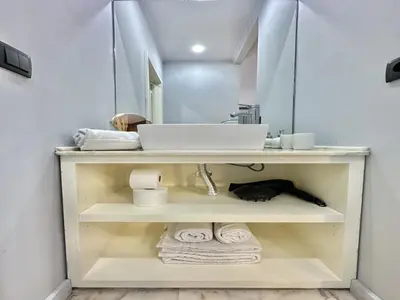 a bathroom with a sink and a mirror at Bright apartment near Bolhao metro station in Porto