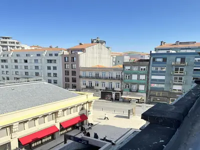 an overhead view of a city with buildings at Bright apartment near Bolhao metro station in Porto