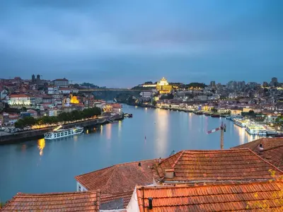 a view of a river with buildings and a city at Bright apartment near Bolhao metro station in Porto