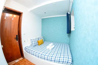 a white desk with a lamp and two chairs at Live Oporto Rooms in Porto