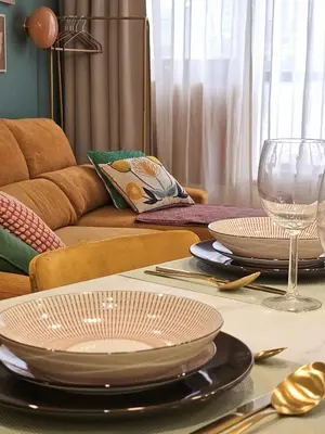 a table with plates and wine glasses on top of it at Ninho Santa Catarina in Porto