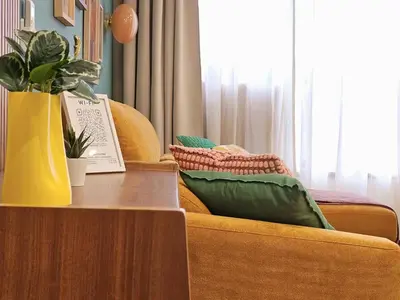 a living room with a couch and a table at Ninho Santa Catarina in Porto