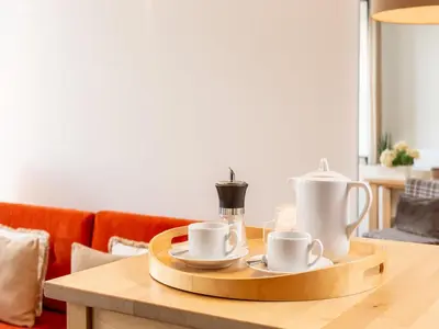 a wooden tray with cups and cups on a table at Apartment near Praia da Luz beach in Porto