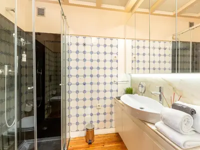a bathroom with a sink and a shower at Charming Porto Studio Central & Cozy in Porto