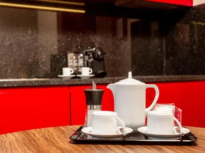 a tray with tea pots and cups on a counter at Chic Porto Studio Cozy & Central Escape in Porto