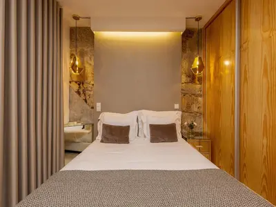 a bedroom with a large bed and a sink at Modern & Cozy apartment, by the beach in Vila Nova de Gaia
