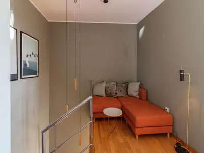 a living room with a couch and a table at Charming 1-Bedroom Apartment in Oporto in Porto