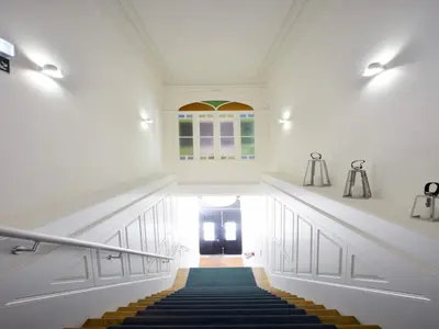 a hallway with stairs and a window and a door at Cozy 1-bedroom apartment in Porto in Porto