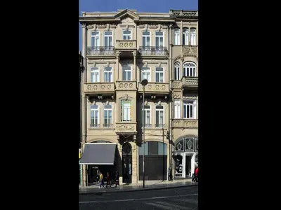 a large building on the side of a street at Cozy 1-bedroom apartment in Porto in Porto