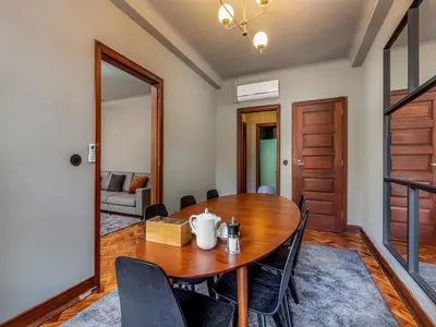 a dining room with a wooden table and chairs at Spacious family apartment in Porto in Porto
