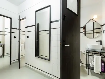 a bathroom with a sink and a mirror at Spacious family apartment in Porto in Porto