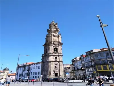 a tall clock tower in the middle of a city at Central City Escape with Balcony in Porto